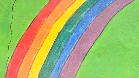 Background of abstract rainbow painted wall, textured backgroundのeditorial素材