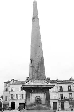 Obelisk in Arles. This noble granite stone was found in 1389 in a garden of the place. It was unearthed in 1564 in the presence of Catherine de' Medici and was restored and erected on the square with great ceremony in 1675.の写真素材