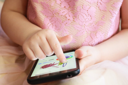 Little girl using mobile phone