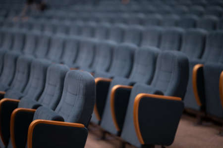 Gray velvet seats for spectators in the theater or cinema