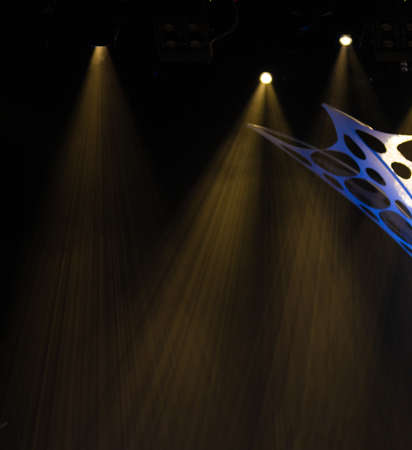 An empty stage of the theater, lit by spotlights and smoke before the performanceの写真素材
