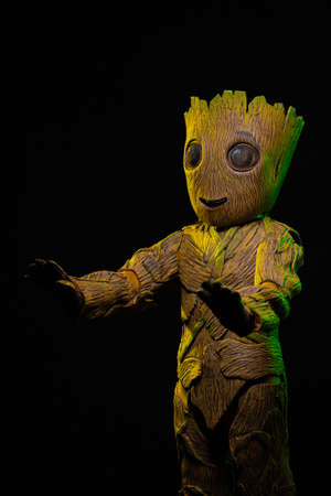 Big toy character, costume tree with twigs and flowersの写真素材