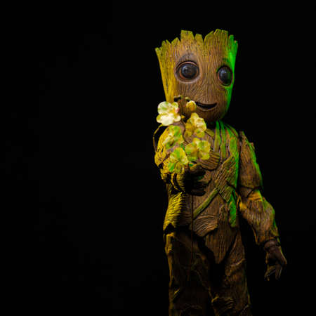 Big toy character, costume tree with twigs and flowersの写真素材