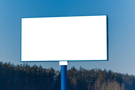 Background for design. Advertising billboard along the road in the city on a winter sunny day