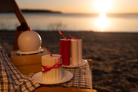 Candles against summer sunset backgroundの写真素材