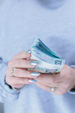 Female hands holding paper bills Belarusian rublesの写真素材