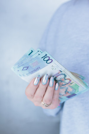 Female hands holding paper bills Belarusian rublesの写真素材