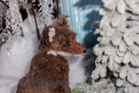 New Year's decorations, toys and garlands in fabulous settings. Toy animals for children in a public...