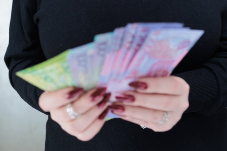 Female hands holding paper bills Belarusian rublesの写真素材