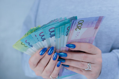 Female hands holding paper bills Belarusian rublesの写真素材
