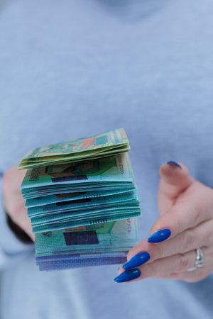 Female hands holding paper bills Belarusian rublesの写真素材