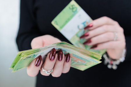 Female hands holding paper bills Belarusian rublesの写真素材