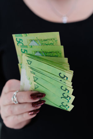 Female hands holding paper bills Belarusian rublesの写真素材