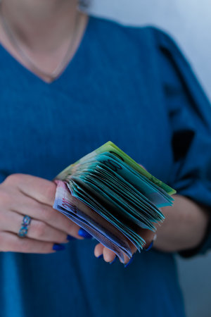 Female hands holding paper bills Belarusian rublesの写真素材