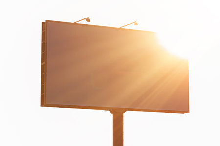 Background for design. Advertising billboard along the road in the city on an autumn sunny eveningの写真素材