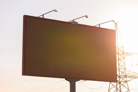 Background for design. Advertising billboard along the road in the city on an autumn sunny eveningの写真素材