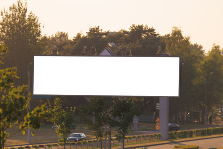 Background for design. Advertising billboard along the road in the city on an autumn sunny eveningの写真素材