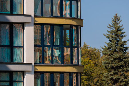 City view on a sunny day. Modern buildings, walls and windows.の写真素材