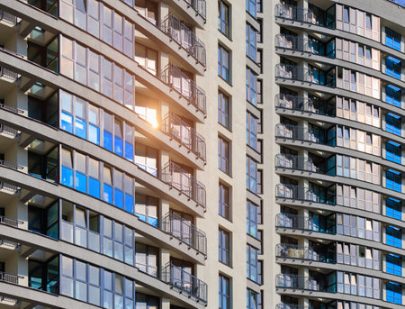 City view on a sunny day. Modern buildings, walls and windows.の写真素材