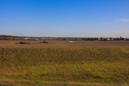 Road shoulder on a sunny autumn day. Views of the landscape from the car window.の写真素材