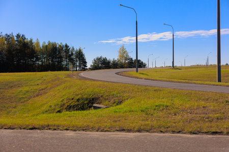 Road shoulder on a sunny autumn day. Views of the landscape from the car window.の写真素材
