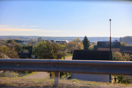 Road shoulder on a sunny autumn day. Views of the landscape from the car window.の写真素材