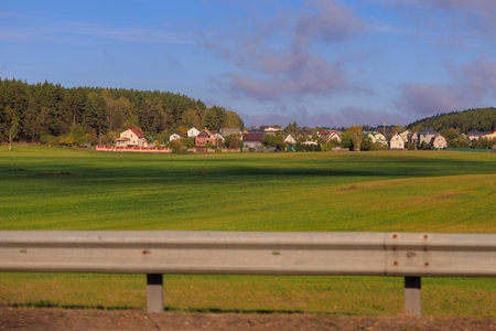Views of the landscape from the road shoulder on a sunny autumn day.の写真素材