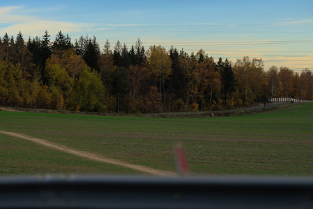 Road shoulder on a sunny autumn day. Views of the landscape from the car window.の写真素材