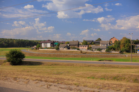 Road shoulder on a sunny autumn day. Views of the landscape from the car window.の写真素材