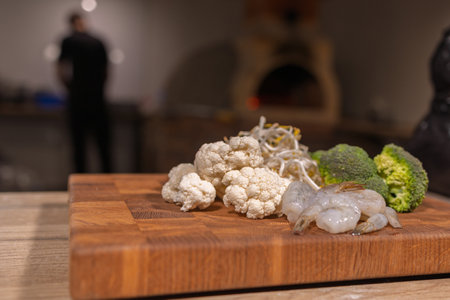 Cooking a dish, vegetables with shrimp and saucesの写真素材