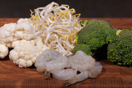Green vegetables, fresh broccoli florets in bowlsの写真素材