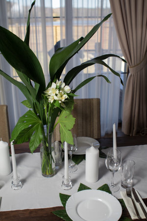 Festive table decorations, flowers and tableware, beautiful table setting for guestsの写真素材