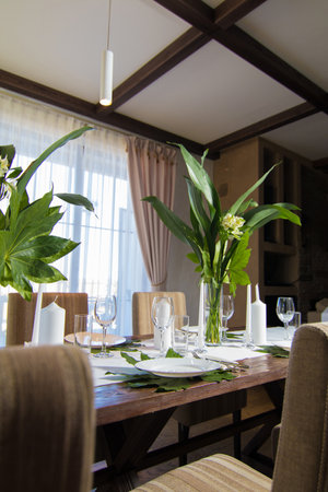 Festive table decorations, flowers and tableware, beautiful table setting for guestsの写真素材