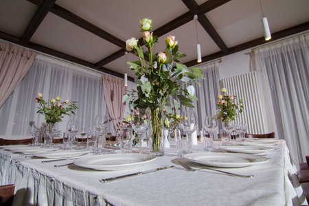 Festive table decorations, flowers and tableware, beautiful table setting for guestsの写真素材