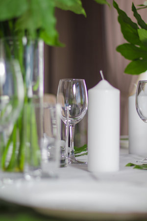 Festive table decorations, flowers and tableware, beautiful table setting for guestsの写真素材