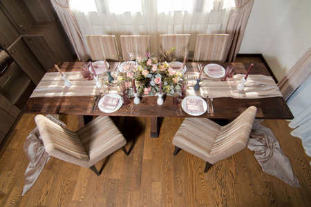 Decorative elements for festive events, home decorations. Festive table decorations, flowers and tablewareの写真素材