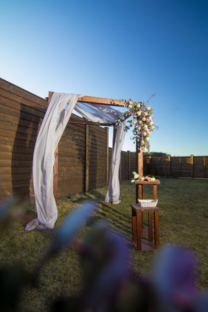 decorative elements for festive events, photo zone with flowers, arch on the grassの写真素材