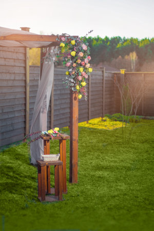 decorative elements for festive events, photo zone with flowers, arch on the grassの写真素材
