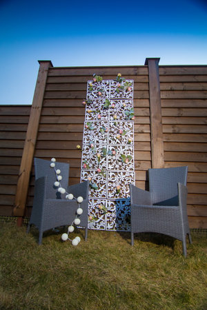 decorative elements for festive events, photo zone with flowers, arch on the grassの写真素材