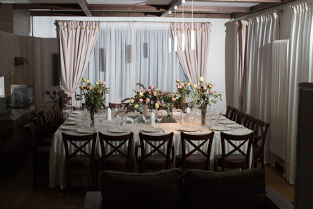 Decorative elements for festive events, home decorations. Festive table decorations, flowers and tablewareの写真素材