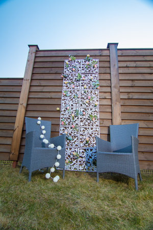 decorative elements for festive events, photo zone with flowers, arch on the grassの写真素材