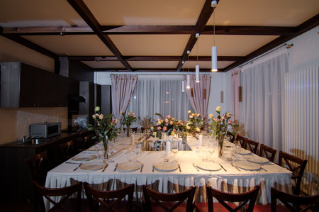 Decorative elements for festive events, home decorations. Festive table decorations, flowers and tablewareの写真素材