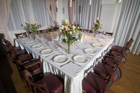 Decorative elements for festive events, home decorations. Festive table decorations, flowers and tablewareの写真素材
