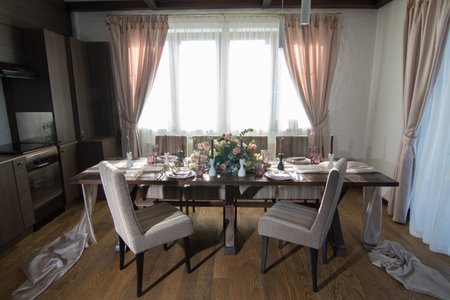 Decorative elements for festive events, home decorations. Festive table decorations, flowers and tablewareの写真素材