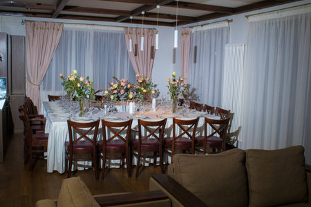 Decorative elements for festive events, home decorations. Festive table decorations, flowers and tablewareの写真素材