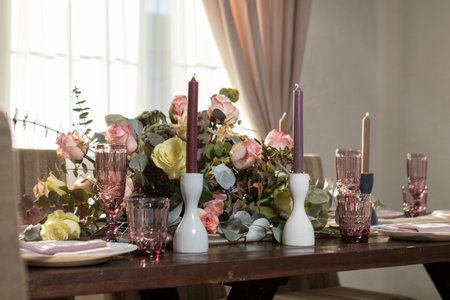 Decorative elements for festive events, home decorations. Festive table decorations, flowers and tablewareの写真素材