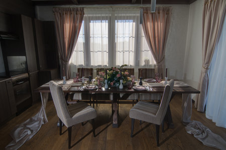 Decorative elements for festive events, home decorations. Festive table decorations, flowers and tablewareの写真素材