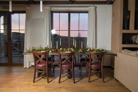 Decorative elements for festive events, home decorations. Festive table decorations, flowers and tablewareの写真素材