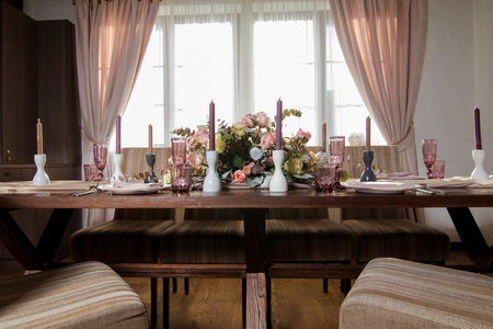 Decorative elements for festive events, home decorations. Festive table decorations, flowers and tablewareの写真素材