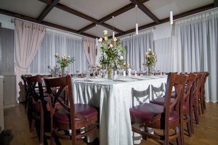 Decorative elements for festive events, home decorations. Festive table decorations, flowers and tablewareの写真素材